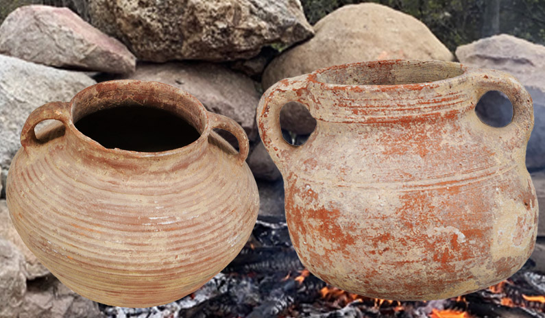 Ancient cooking pots on a fire